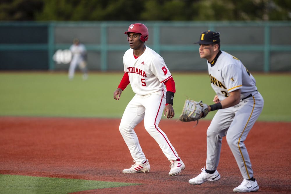 <p>Freshman Devin Taylor gets a lead off first base April 7, 2023, at Bart Kaufman Field. Indiana baseball beat Iowa 4-2 on Sunday to win the series﻿ 2-1.</p>
