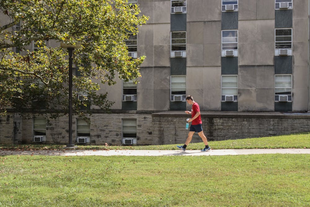 Freshman Colin Altmix walks Aug. 29, 2021, in front of Ashton Residence Center. Only two buildings in the Ashton complex are operating as COVID-19 isolation housing.