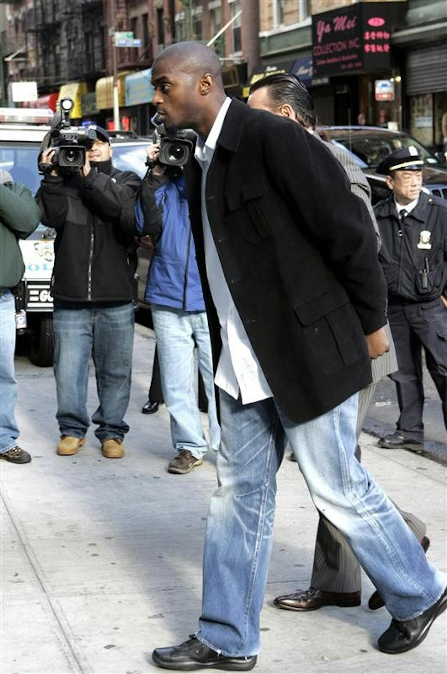 In this Dec. 1, 2008 file photo,  New York Giants' Plaxico Burress arrives at Manhattan Supreme Court for arraignment, in New York. Many NFL players recoil when they think about what Plaxico Burress is going through - and what still awaits. 