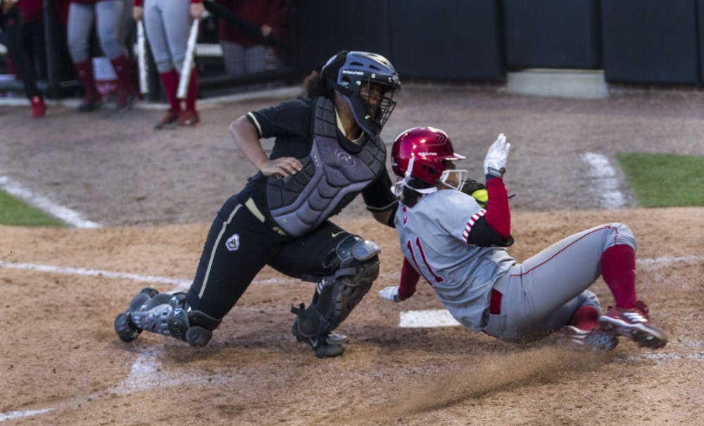 <p>Centerfielder Rebecca Blitz is tagged out by the Purdue's catcher as she tries to make an infield home run. The Hoosiers won both games against the Boilermakers on Wednesday at Purdue in West Lafayette, Indiana.</p>