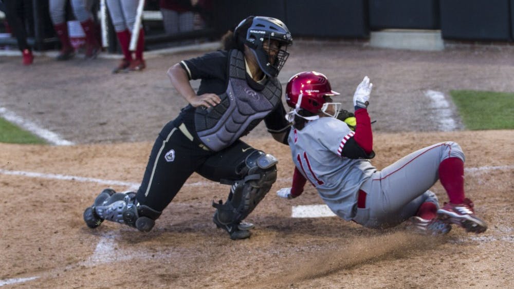 Centerfielder Rebecca Blitz is tagged out by the Purdue's catcher as she tries to make an infield home run. The Hoosiers won both games against the Boilermakers on Wednesday at Purdue in West Lafayette, Indiana.