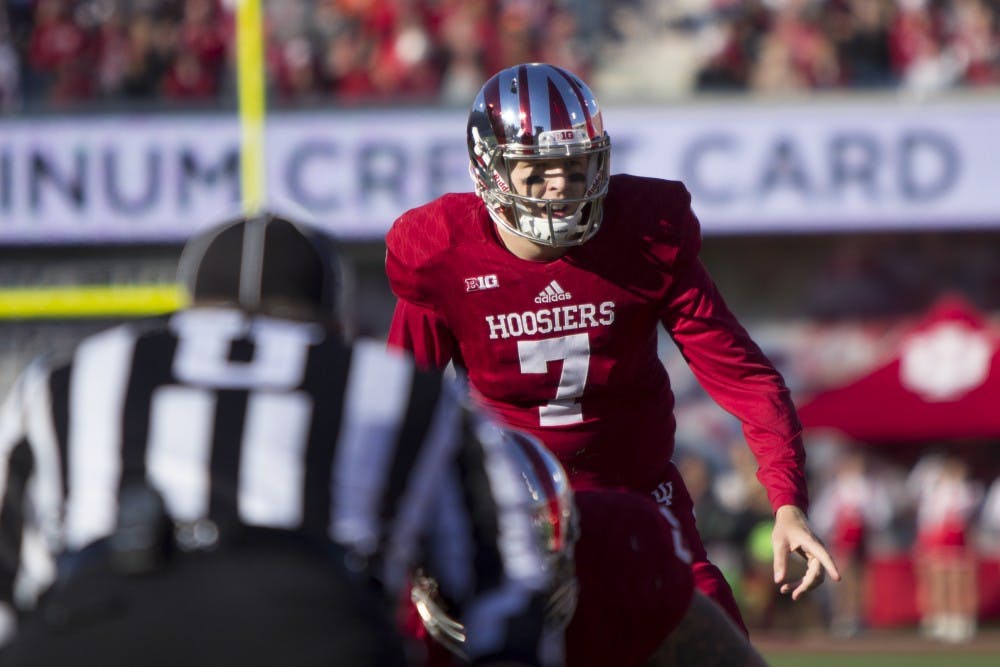 Quarterback Nate Sudfeld yells to his teammates before a second quarter play against Rutgers at Memorial Stadium on Saturday.