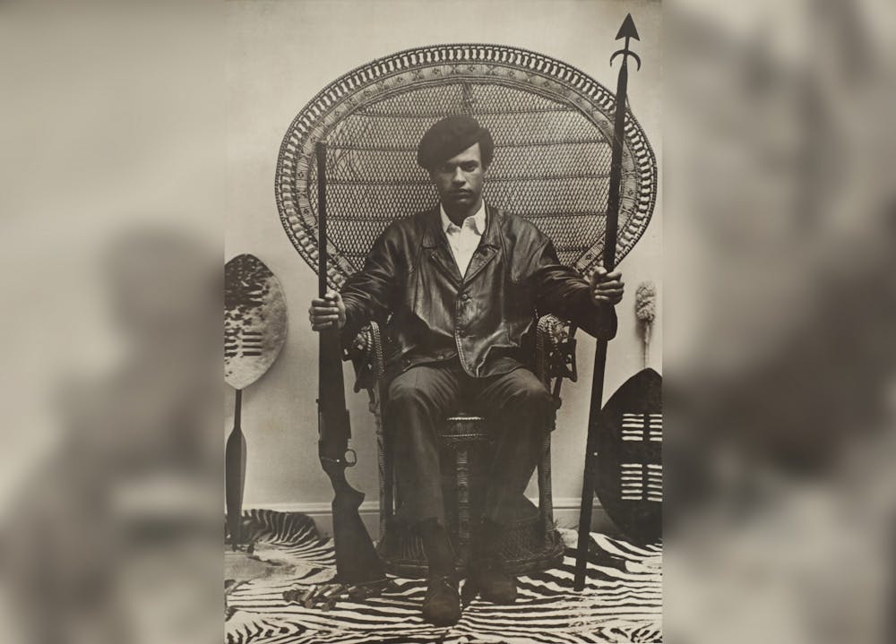 <p>A poster of ﻿Dr. Huey P. Newton holding a spear and shotgun. Newton is most well known for being a co-founder of the Black Panther Party. <em>Collection of</em><em> the Smithsonian National Museum of African American History and Culture</em>.</p>