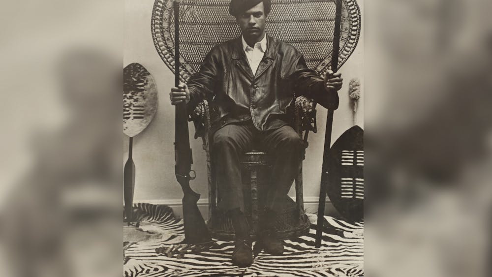 A poster of ﻿Dr. Huey P. Newton holding a spear and shotgun. Newton is most well known for being a co-founder of the Black Panther Party. Collection of the Smithsonian National Museum of African American History and Culture.