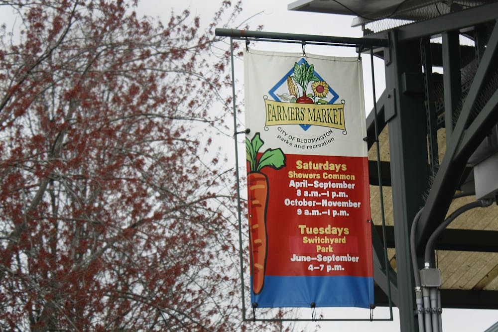 <p>A sign is pictured April 2, 2022, for the Bloomington Community Farmers&#x27; Market. The sign contains dates and times of when the market will be running. </p>