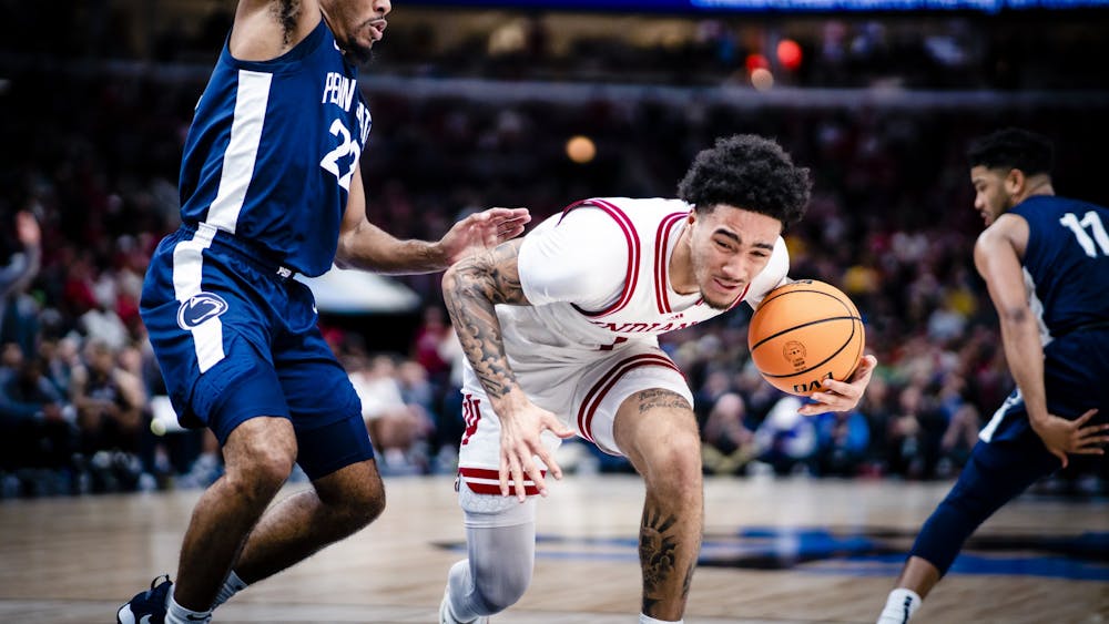 Freshman guard Jalen Hood-Schifino trips while driving to the basket Mar. 11, 2023, at the United Center in Chicago, Illinois. Penn State defeated Indiana 77-73.