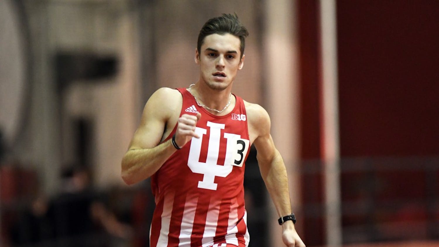 Senior Daniel Kuhn races in the 400m dash against Tennessee on January 6 in Harry Gladstein Fieldhouse. The IU men tied Tennessee, 59-59.