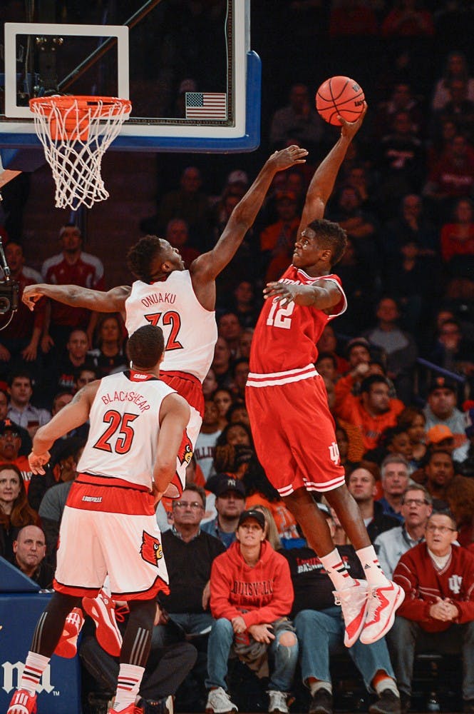 Junior Hanner Mosquera-Perea rises up to dunk the ball during IU's game against Louisville on Tuesday at Madison Square Garden in New York City.
