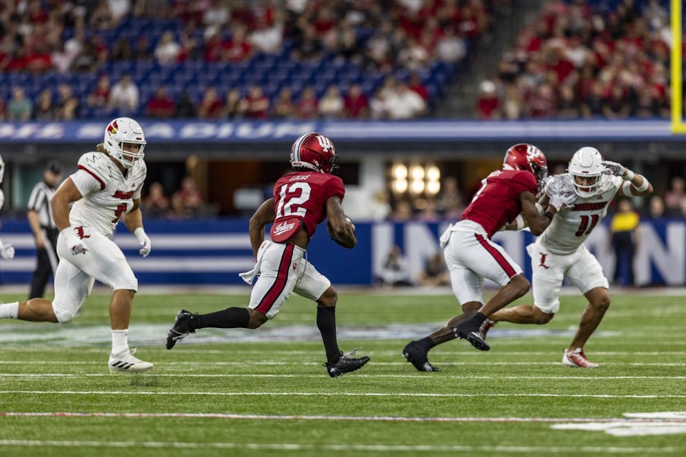 <p>Sophomore running back Jaylin Lucas runs the ball ﻿against the University of Louisville Sept. 16, 2023, at Lucas Oil Stadium in Indianapolis. The Cardinals defeated the Hoosiers 21-14.</p>