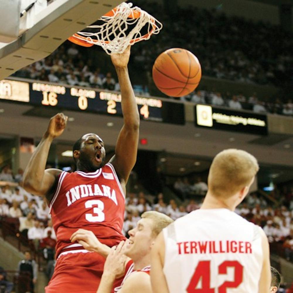 Jacob Kriese  IDSSenior forward D.J. White slams the ball over teammate Lance Stemler and Ohio State's Matt Terwilliger (42) Sunday night in Columbus, Ohio.  White led the hoosiers with 21 points and 13 rebounds earning his 15th double-double.