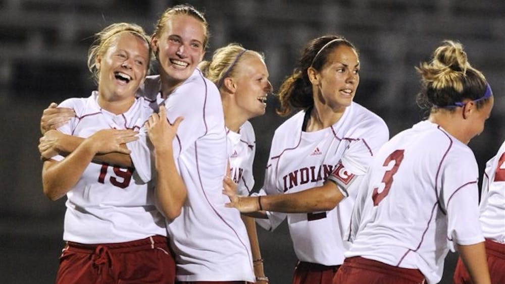 IU players celebrate with Natalie O'Bryan, left, after O'Bryan scored late in the second half of an exhibition match on Aug. 15, 2009 at Bill Armstrong Stadium. The game ended with a 1-1 tie.