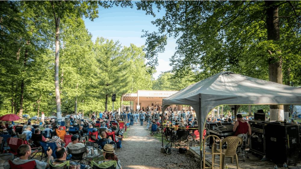 Audience members sit and watch a performance at Bill Monroe's Bean Blossom Bluegrass Festival. The festival will be returning this year from June 9 to 16.