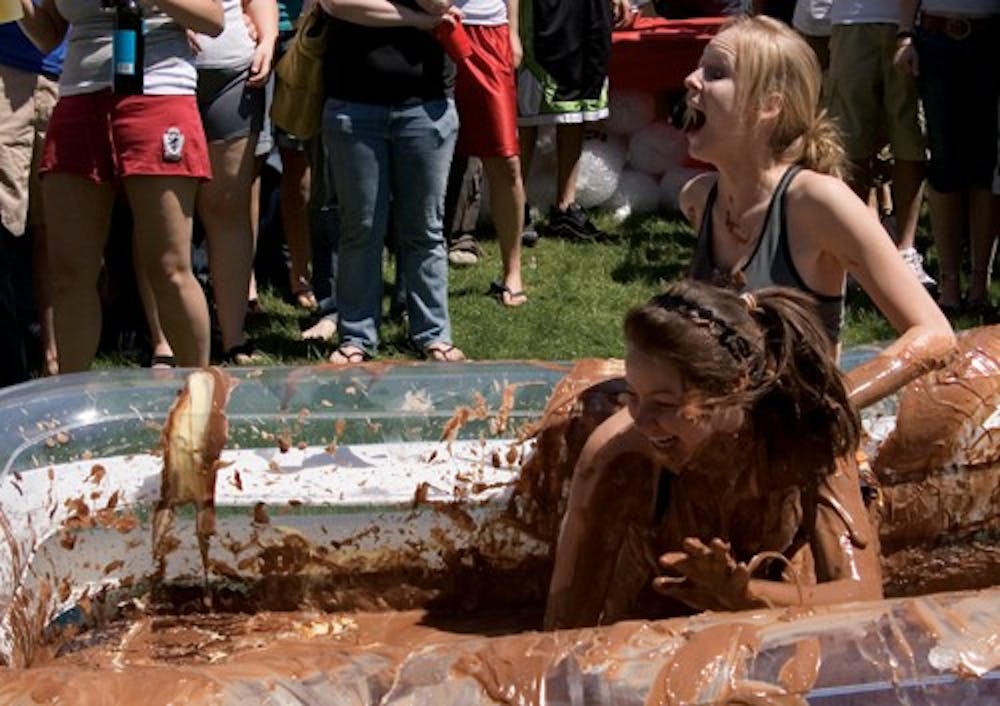 IU sophomores Jessica Kirsh and Kristen Cain compete in the annual Pudding Wrestling Tournament Friday afternoon at Terra Trace Apartments. The tournament ended later in the day when the pool was torn.
