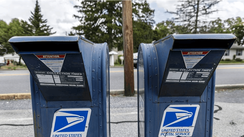 United States Postal Service mail collection boxes sit on a sidewalk in Pennsylvania.