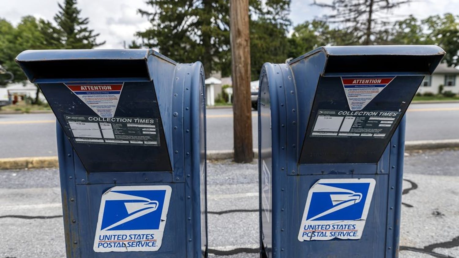 United States Postal Service mail collection boxes sit on a sidewalk in Pennsylvania.