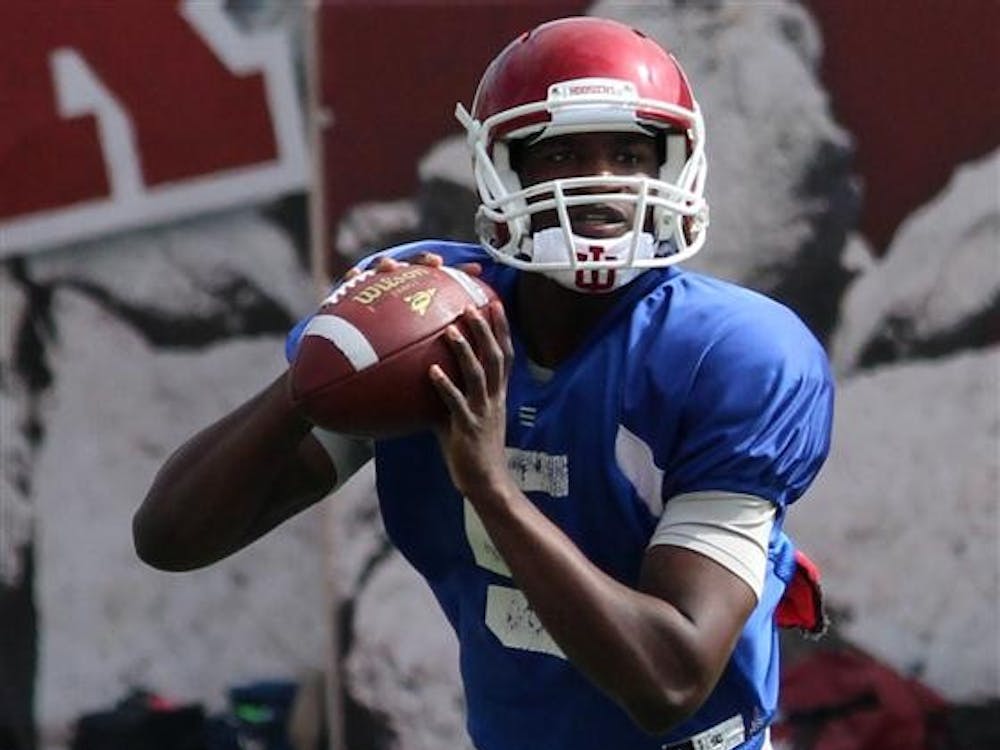 Rising sophomore quarterback Tre Roberson searches for a receiver during practice March 31 a Memorial Stadium.