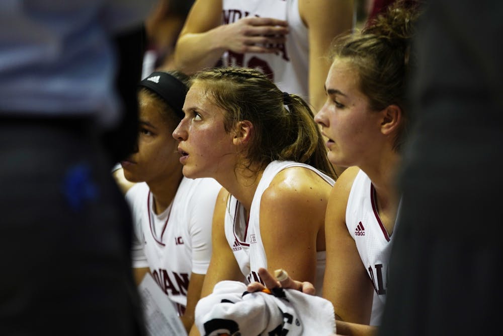 <p>Redshirt Junior Ali Patberg and sophomore Aleksa Gulbe listen to the coaches Jan. 27 in Simon Skjodt Assembly Hall. IU defeated Minnesota 65-52. </p>