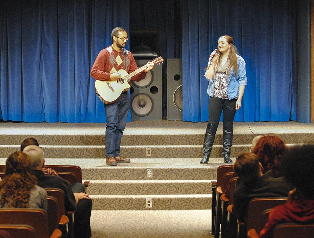 Emily sings “You and I” by Ingrid Michaelson at the School of Social Work’s talent show. After getting off stage, she said she hadn’t performed in front of people in years. 
