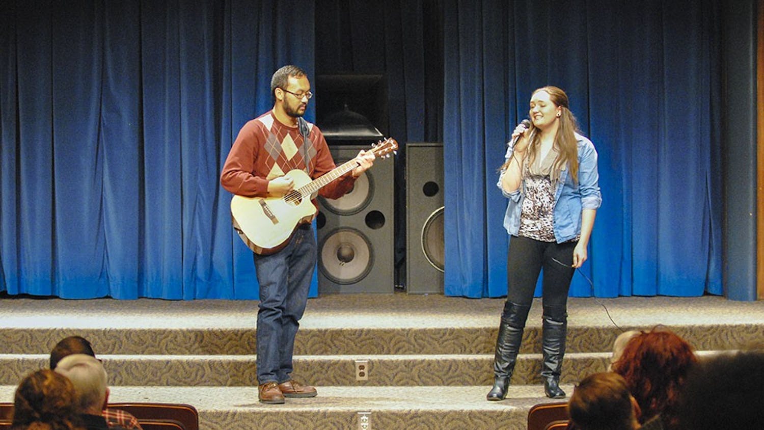 Emily sings “You and I” by Ingrid Michaelson at the School of Social Work’s talent show. After getting off stage, she said she hadn’t performed in front of people in years. 
