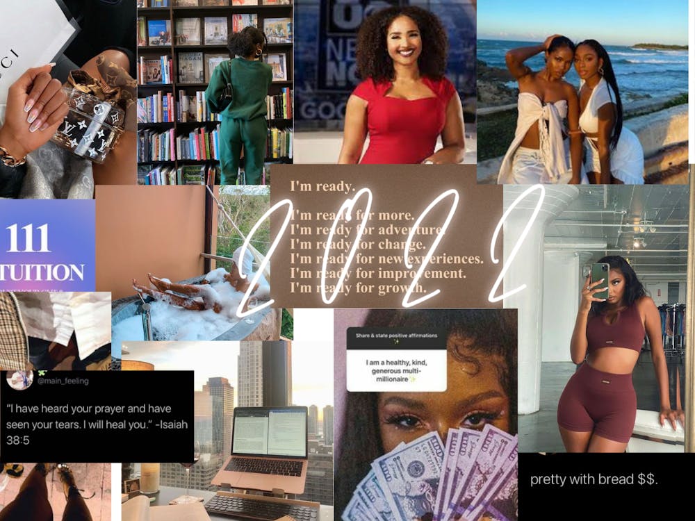 A vision board created by Amani Gates on December 31, 2021 is seen. The vision board depicts a collage of images and ideas that she wants to accomplish in the new year.