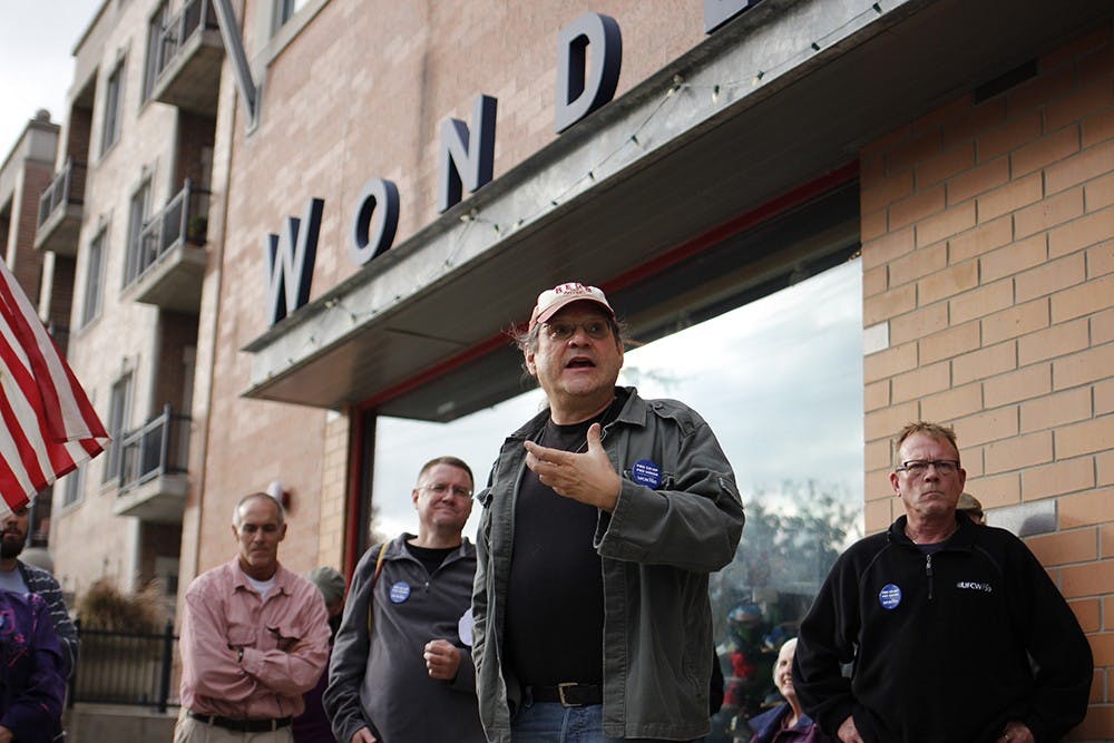 IU Professor Joe Varga speaks outside of Wonderlab, where the Bloomingfoods annual meeting took place, Wednesday during a pro-unionization rally.