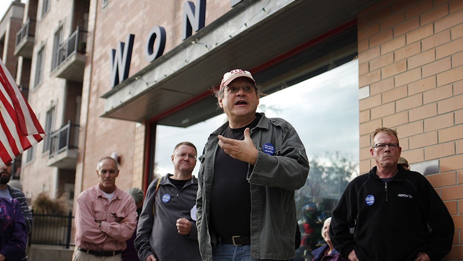 IU Professor Joe Varga speaks outside of Wonderlab, where the Bloomingfoods annual meeting took place, Wednesday during a pro-unionization rally.