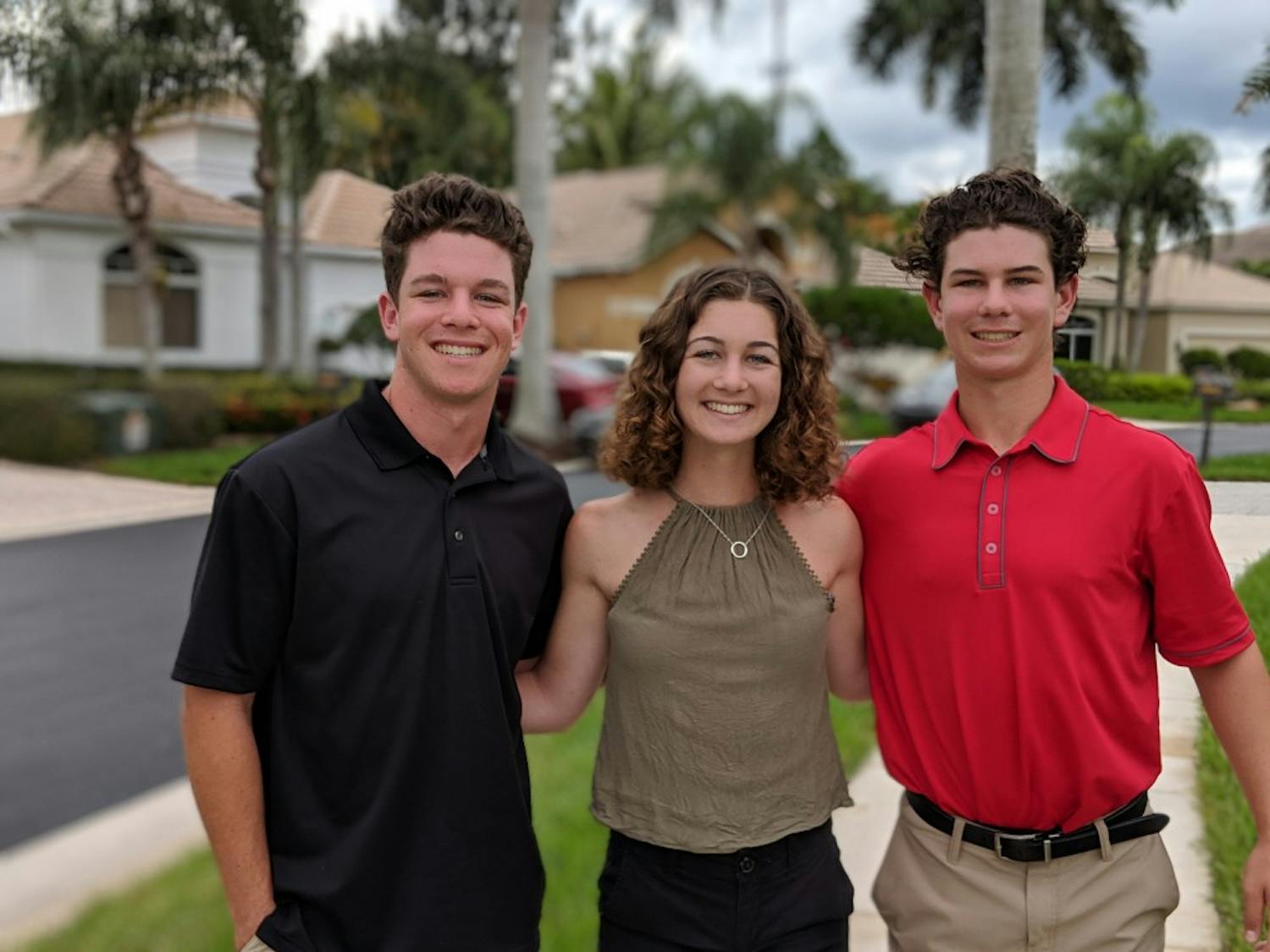 Emily Isaacman poses at Thanksgiving with younger brothers Max, 17, and Zach, 14. Max and Zach both attend Torrey Pines High School in San Diego.