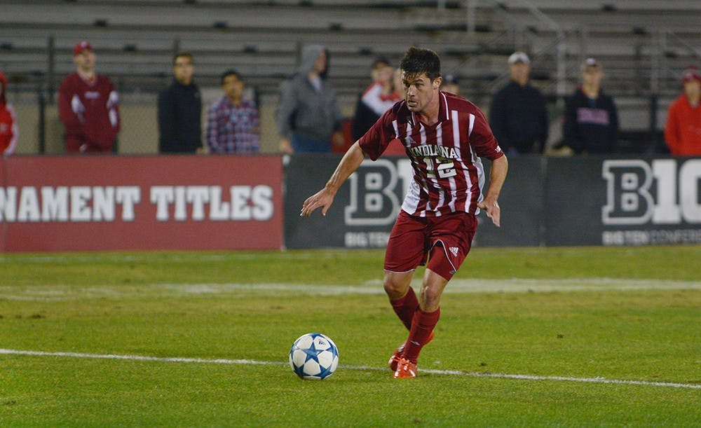 Freshman Austin Panchot gets ready to strike during the game with University of Michigan on Saturday night. IU won the game 1-0. 