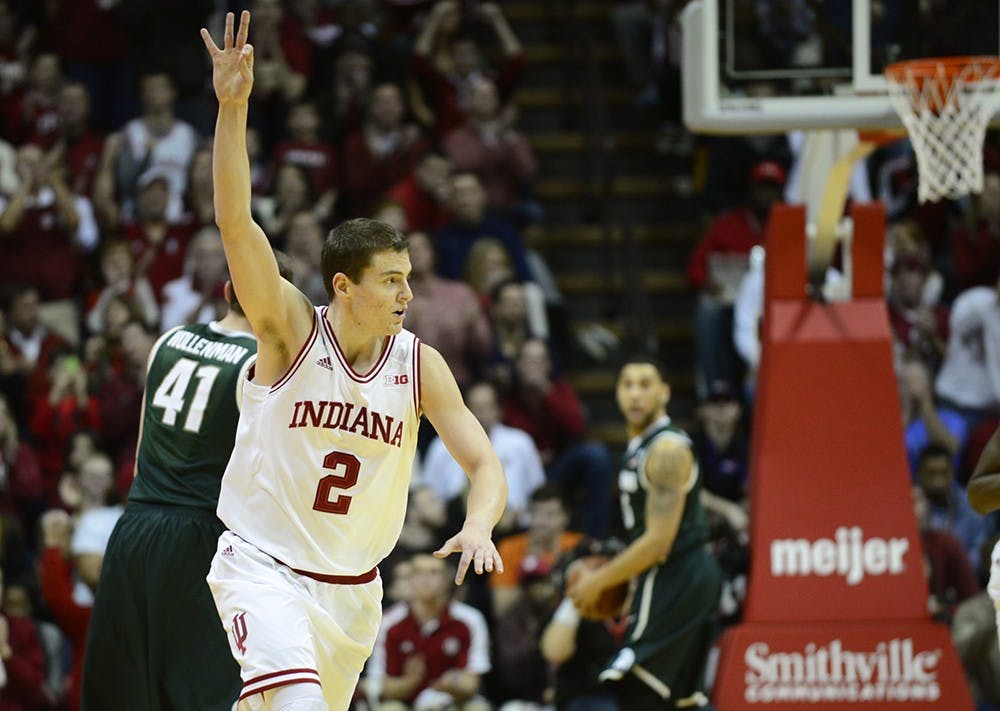 Junior Nick Zeisloft celebrates a made three-point shot during IU's game against Michigan State on Saturday at Assembly Hall.