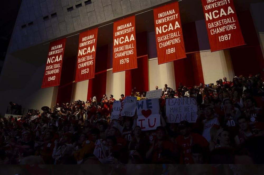 Hoosier fans cheer for IU underneath the five national championship banners, before the game against OSU on March 5 at Assembly Hall. IU will face Michigan on March 10 at the Crisler Center in Ann Arbor.