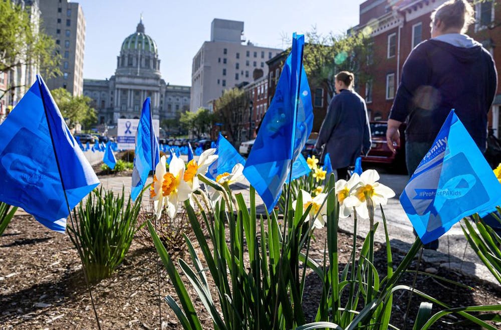 <p>Blue ribbon flags line State Street April 4, 2023, in Harrisburg, PA, in recognition of National Child Abuse Prevention Month. In 2021, approximately 13 children of every 1,000 in Indiana suffered maltreatment, according to a report <a href="https://cwoutcomes.acf.hhs.gov/cwodatasite/pdf/indiana.html" target="_blank"></a>by the U.S. Department of Health and Human Services.</p>