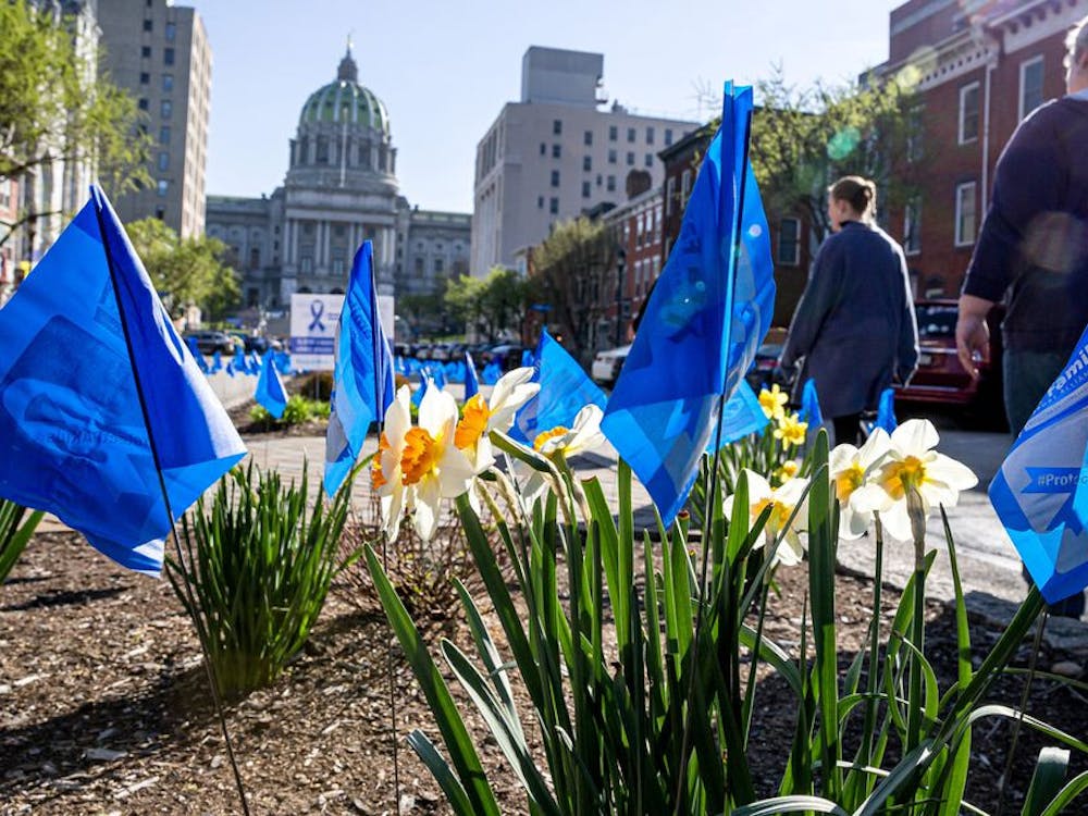 Blue ribbon flags line State Street April 4, 2023, in Harrisburg, PA, in recognition of National Child Abuse Prevention Month. In 2021, approximately 13 children of every 1,000 in Indiana suffered maltreatment, according to a report by the U.S. Department of Health and Human Services.