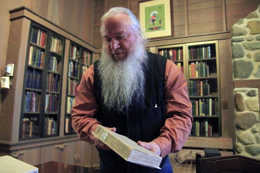 Canary explains how he plans to fix the deathbed editions of Walt Whitman's "Leaves of Grass." Canary has worked at the Lilly Library for 32 years.&nbsp;