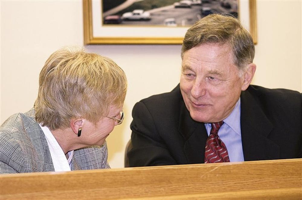 Professor Mary Jo Kane talks with Former Senator Birch Bayh during the Title IX panel discussion in 2004 at IU. Bayh will speak today on campus.