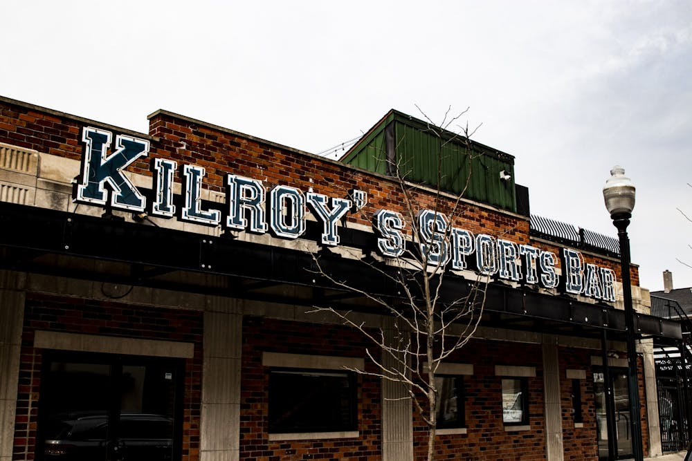 <p>Kilroy’s Sports Bar stands without its lights on March 9 on Walnut Street. </p>