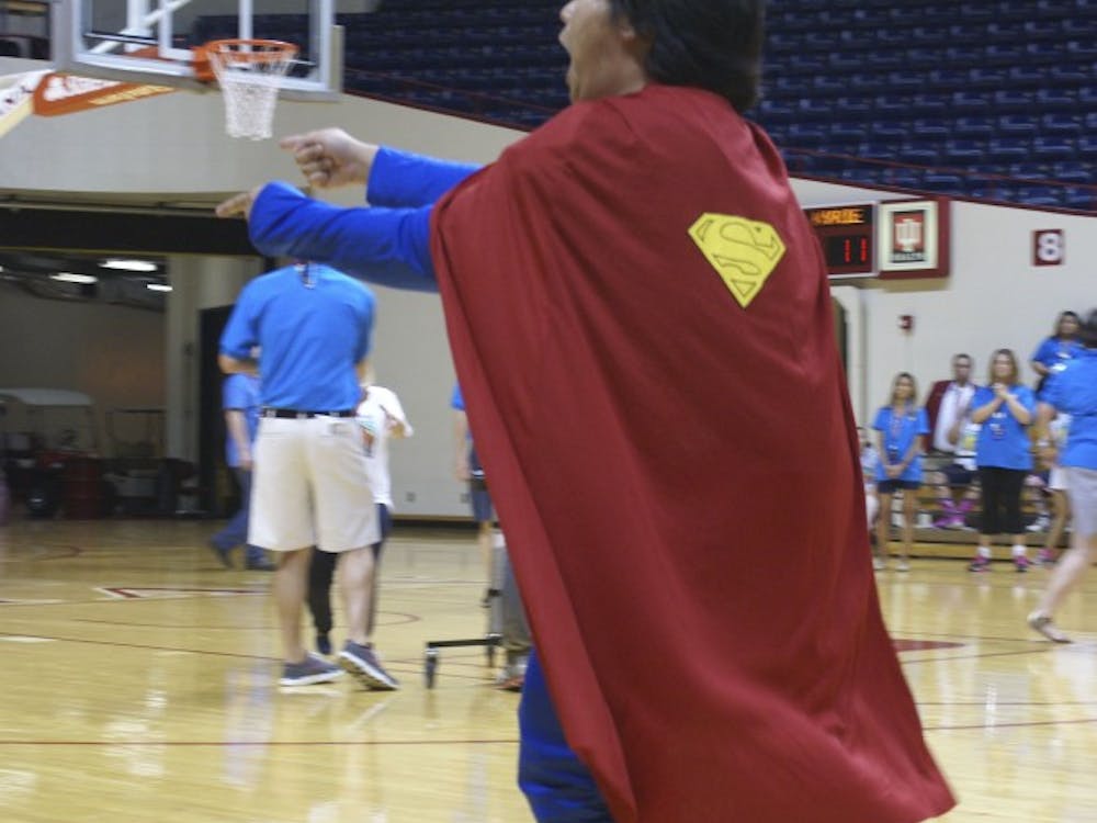Chris Watkins dressed as Superman cheers on the basketball team at the 25th annual Best Buddies Leadership Conference pep rally Saturday night at Assembly Hall. 