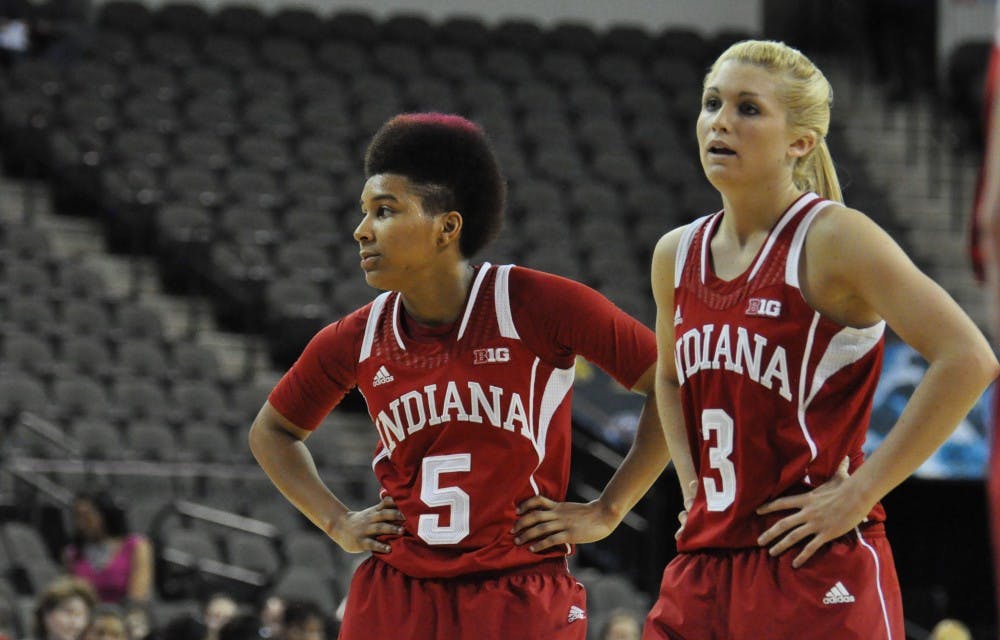 Sophomore guard Larryn Brooks and freshman guard Tyra Buss look on in IU's 63-52 loss Thursday against Rutgers.