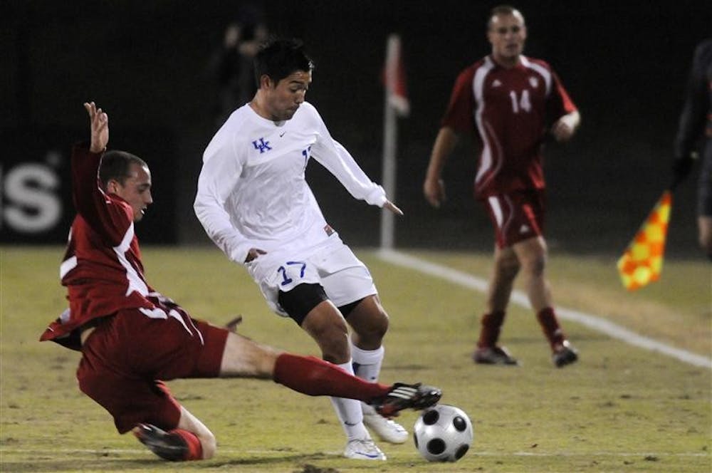 IU sophomore midfielder Rich Balchan, left, kicks the ball away from Kentucky senior Michael Strong during a soccer game Wednesday at Bill Armstrong Stadium. The game ended in a 1-1 tie.