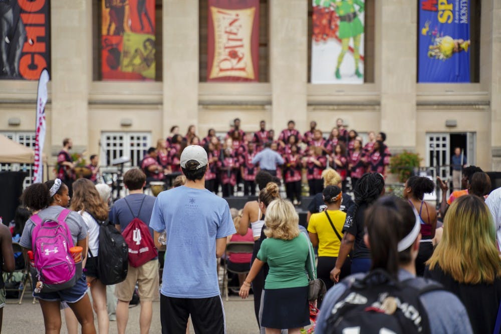<p>The African American Choral Ensemble performs during the First Thursdays Festival Sept. 6 at the Fine Arts Plaza. The group performed during the 25th Anniversary of the "Potpourri of the Arts" concert.</p>