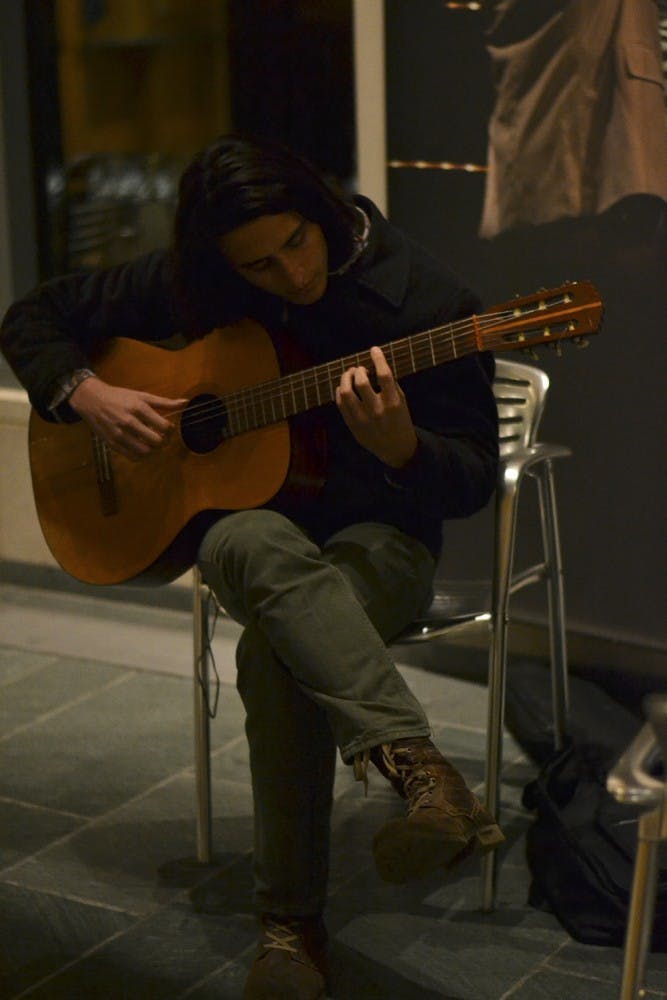 IU student Guy Frydenlund practices before auditioning for either a vocal or guitar part in The Soul Revue. The Soul Revue is known for performing traiditional black popular music, and is directed by Dr. Tyron Cooper, who is an assistant professor of African American studies at IU. 