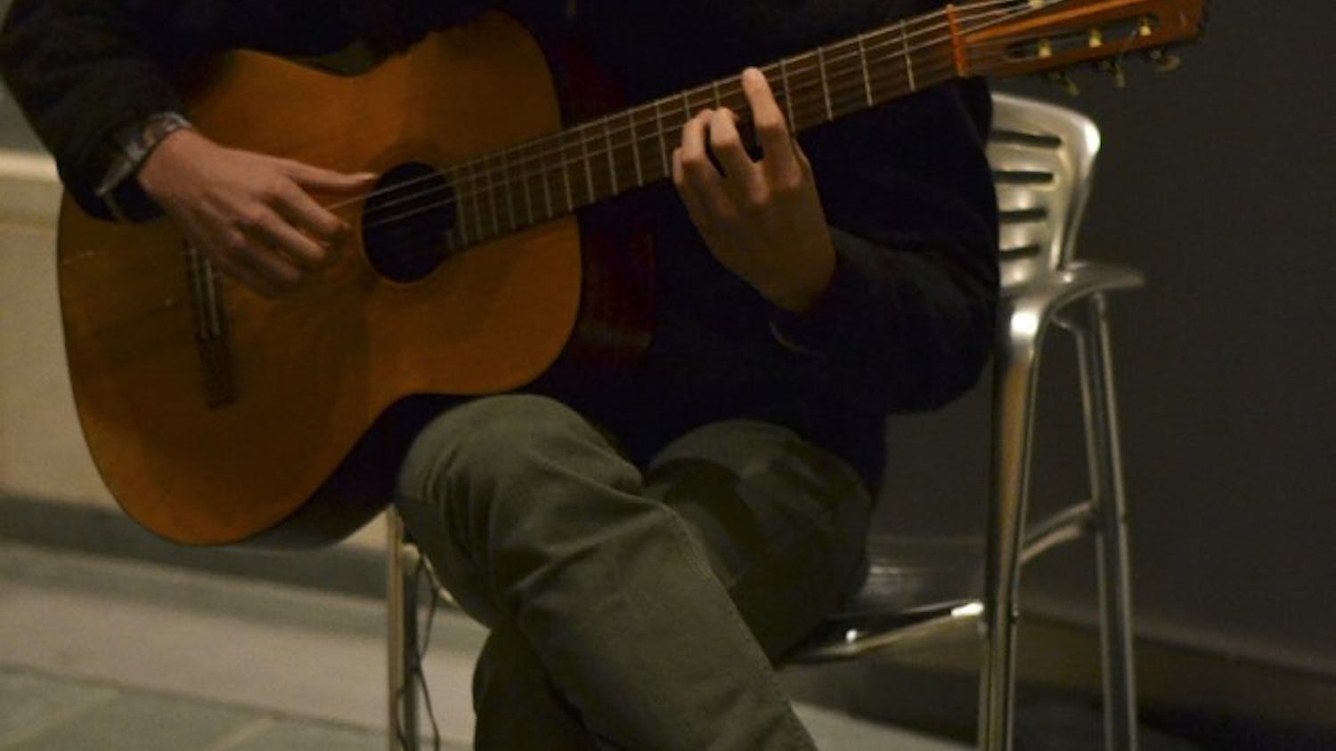IU student Guy Frydenlund practices before auditioning for either a vocal or guitar part in The Soul Revue. The Soul Revue is known for performing traiditional black popular music, and is directed by Dr. Tyron Cooper, who is an assistant professor of African American studies at IU.
