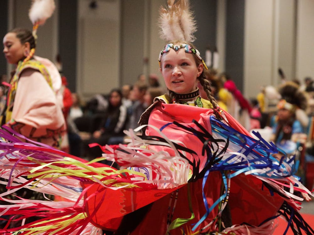 A girl dances during the IU Traditional Powwow on April 9, 2022, at the Marching Hundred Hall. A group of women performed a traditional scarf dance.  