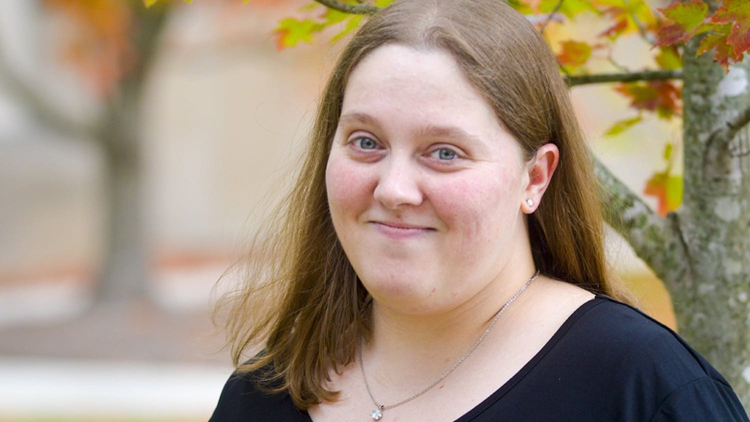 Full-time IU student and mom Sheryl Stevens takes a break from her Intro to German Culture class Monday afternoon to do a quick photoshoot outside of the Global & International Studies Building.
