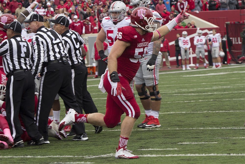 Dfensive end Nick Mangieri celebrates after IU recovered a fumble in the first half of play against Ohio State on Saturday at Memorial Stadium. IU lost 34-27.