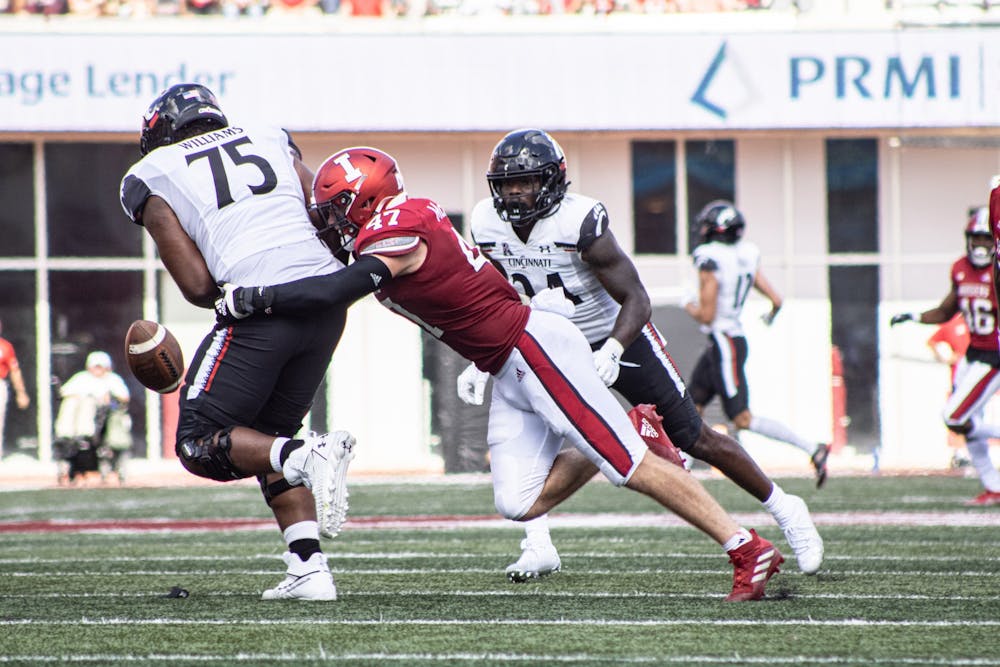 <p>Senior Micah McFadden steals the ball from a Cincinnati Bearcats player of the ball on Sept. 18, 2021, at Memorial Stadium. McFadden was drafted by the New York Giants as the 146th pick in the 2022 NFL Draft on Saturday.</p>