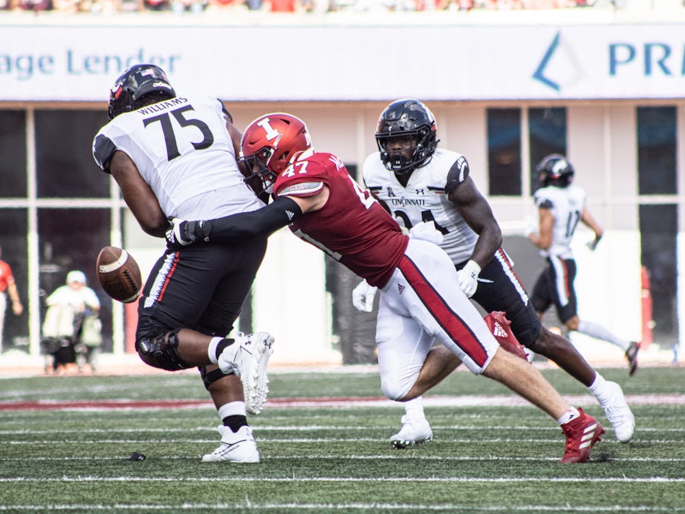 Senior Micah McFadden steals the ball from a Cincinnati Bearcats player of the ball on Sept. 18, 2021, at Memorial Stadium. McFadden was drafted by the New York Giants as the 146th pick in the 2022 NFL Draft on Saturday.