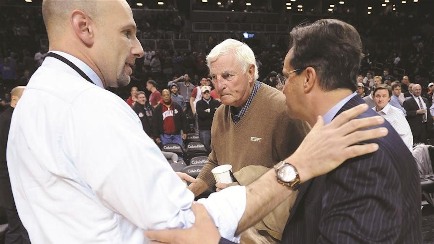 Head coach Tom Crean runs over to former head coach Bob Knight to shake his hand after the Indiana Georgia Progressive Legends Classic tournament game at the Barclay Center in Brooklyn, NY. Monday, Nov. 19, 2012. ESPN analyst Dan Shulman is at left.