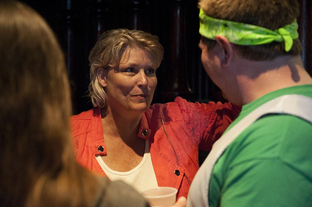 Hannah Wilson's mother, Robin Lewis, interacts with Hannah's friends on Sunday evening at The Dunnkirk. The event was held to remember Hannah and the proceeds of the $5 cover charge will be donated to Hannah's family.