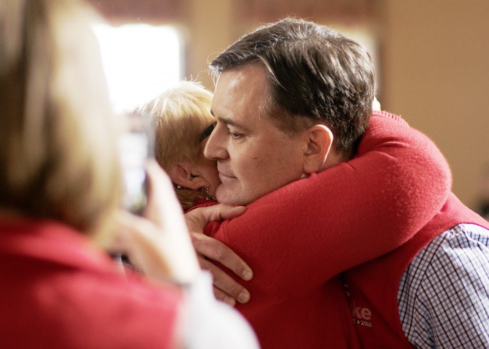 Rep. Luke Messer, R-6th District, hugs Barb Hackman, Bartholomew County Republican Party chair, after winning a Congress of Counties U.S. Senate Republican straw poll by 65 votes on Saturday. Runner-up Rep. Todd Rokita, R-4th District, received 82.