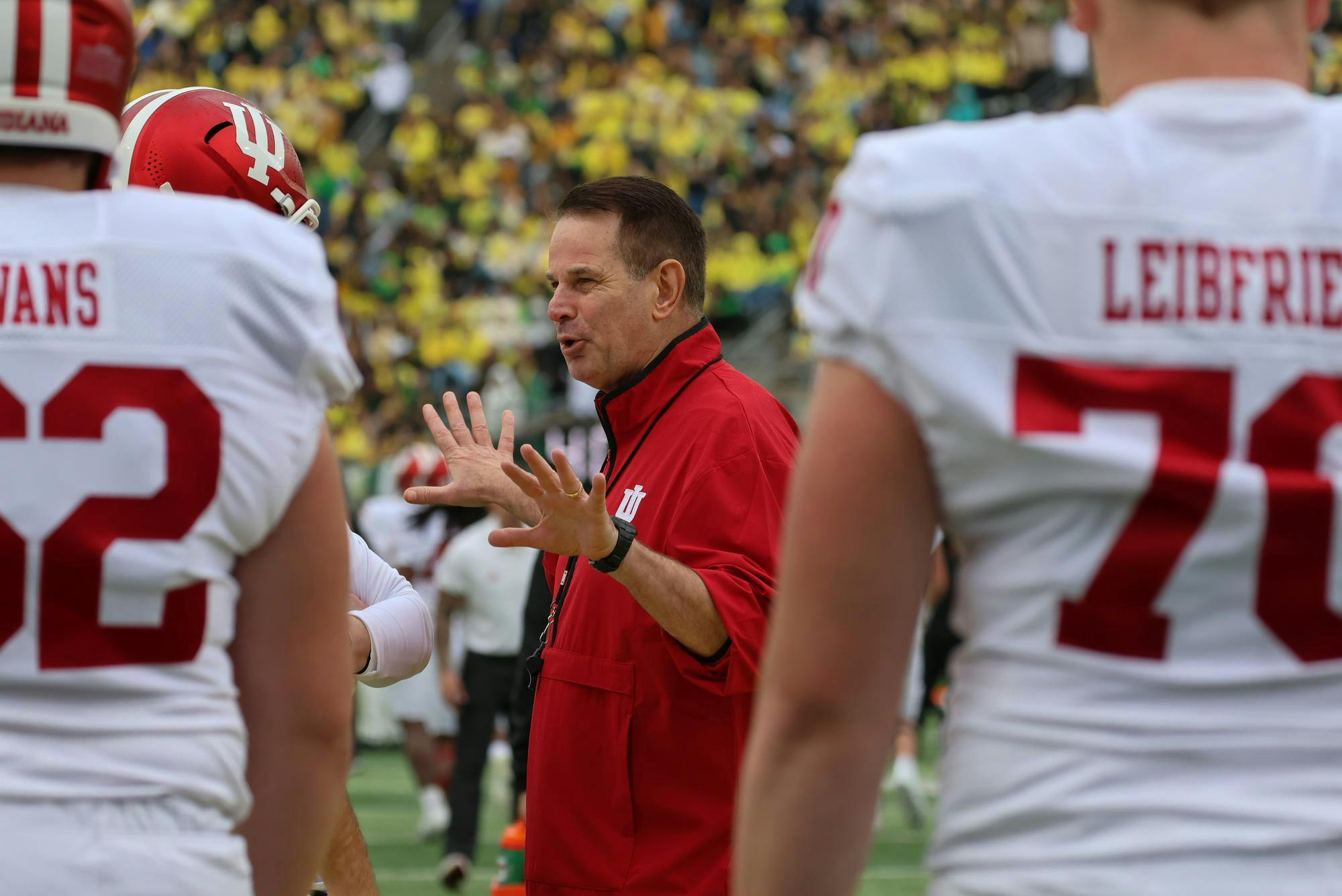 Head Coach Curt Cignetti chats with quarterback Fernando Mendoza before they take on the Oregon Ducks at Autzen Stadium on Oct. 11. The Hoosiers dominated the ducks 30-20 in Eugene.  